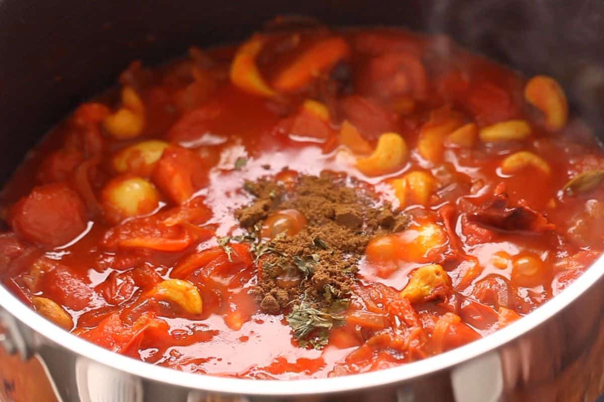 When tomatoes begin to soften, spices and kasoori methi is added.