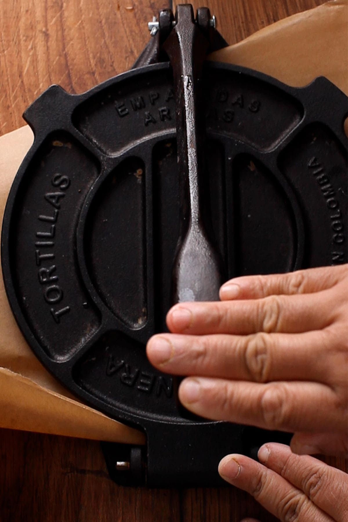 Roti is shaped using a atortilla press.