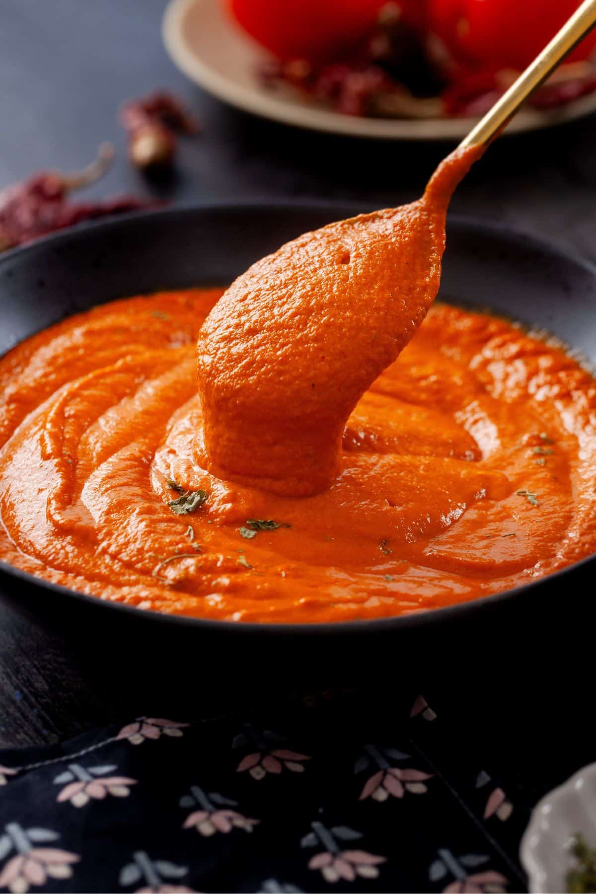 Makhani Sauce is poured with a spoon. 