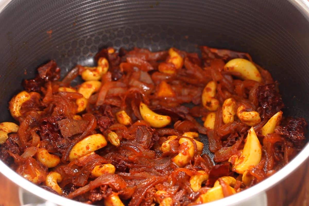 Spices and onions are sautéed to toast the spices.