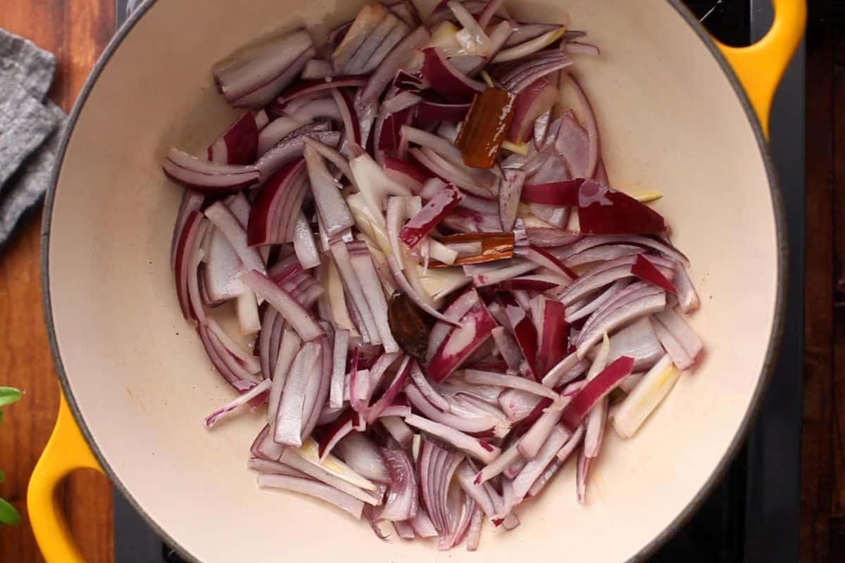 Onions are added to ghee.
