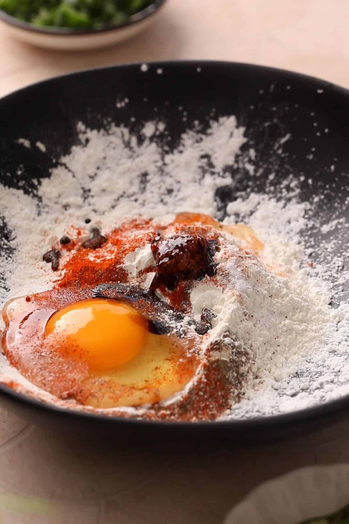 Marinade ingredients in a black bowl. 