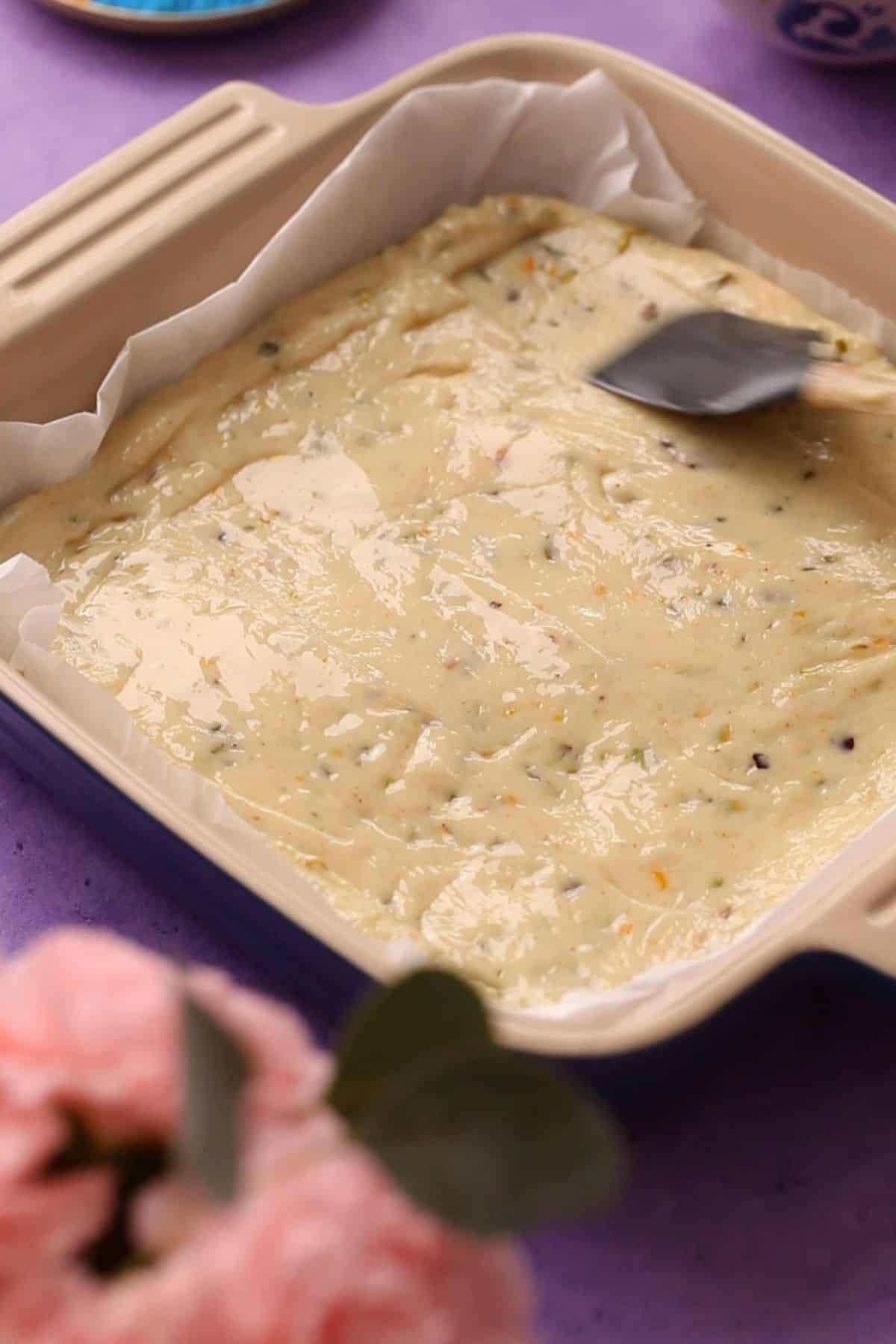 Spreading thandai fudge mixture.