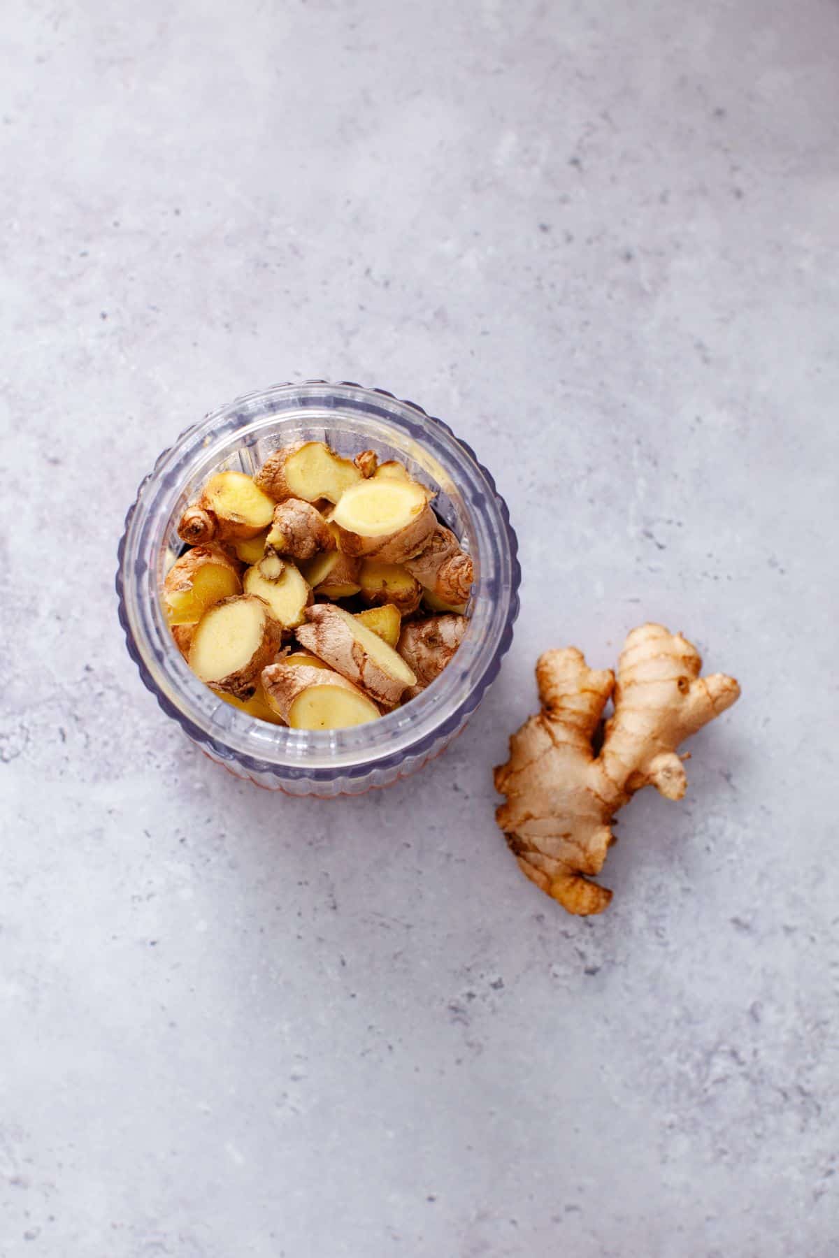 Chopped ginger is placed in a blender jar.