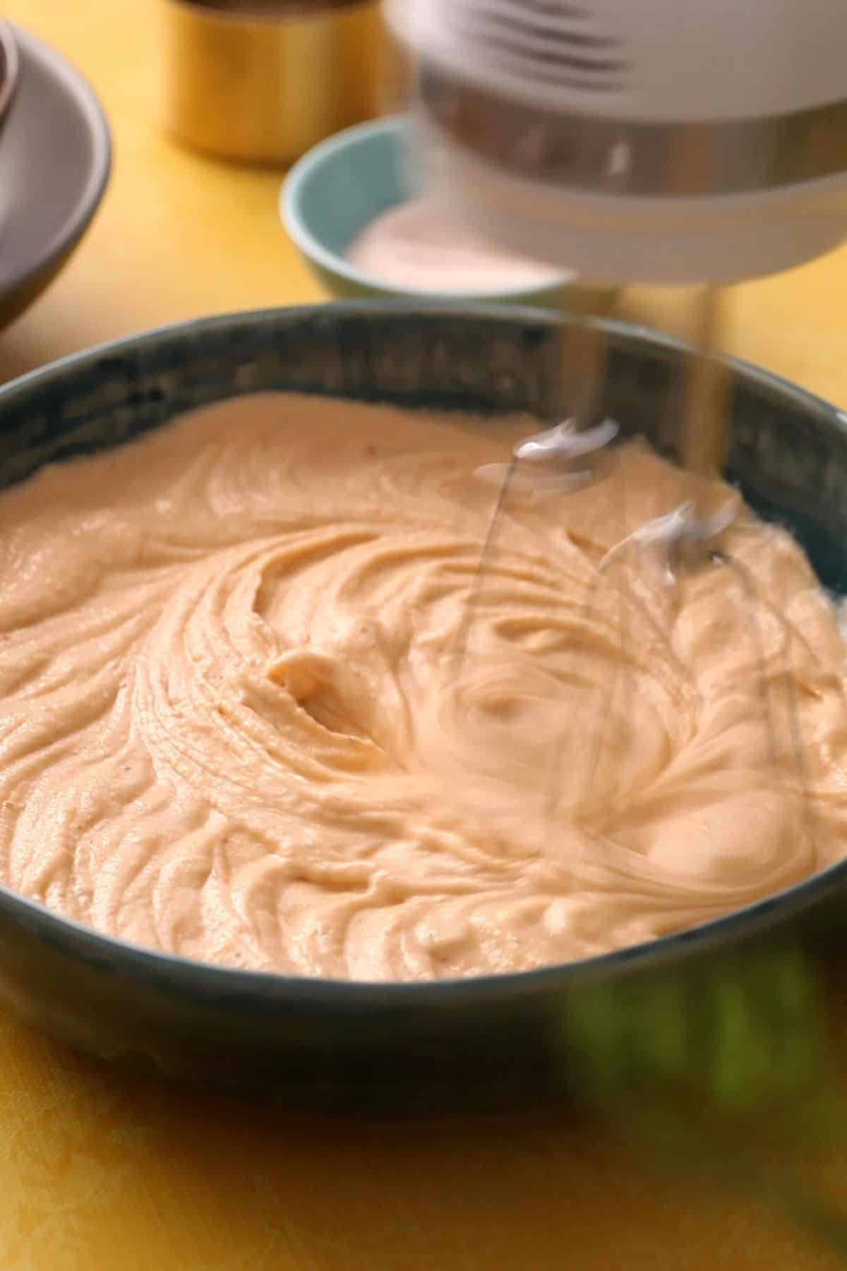 Ground lentil mixture is beaten with hand mixer.