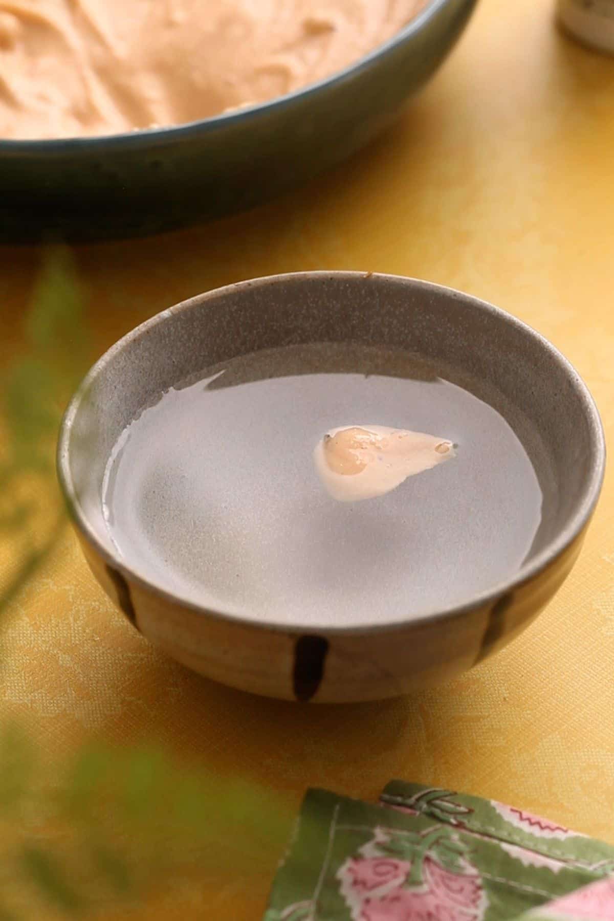 Lentil batter fluffiness is being checked.