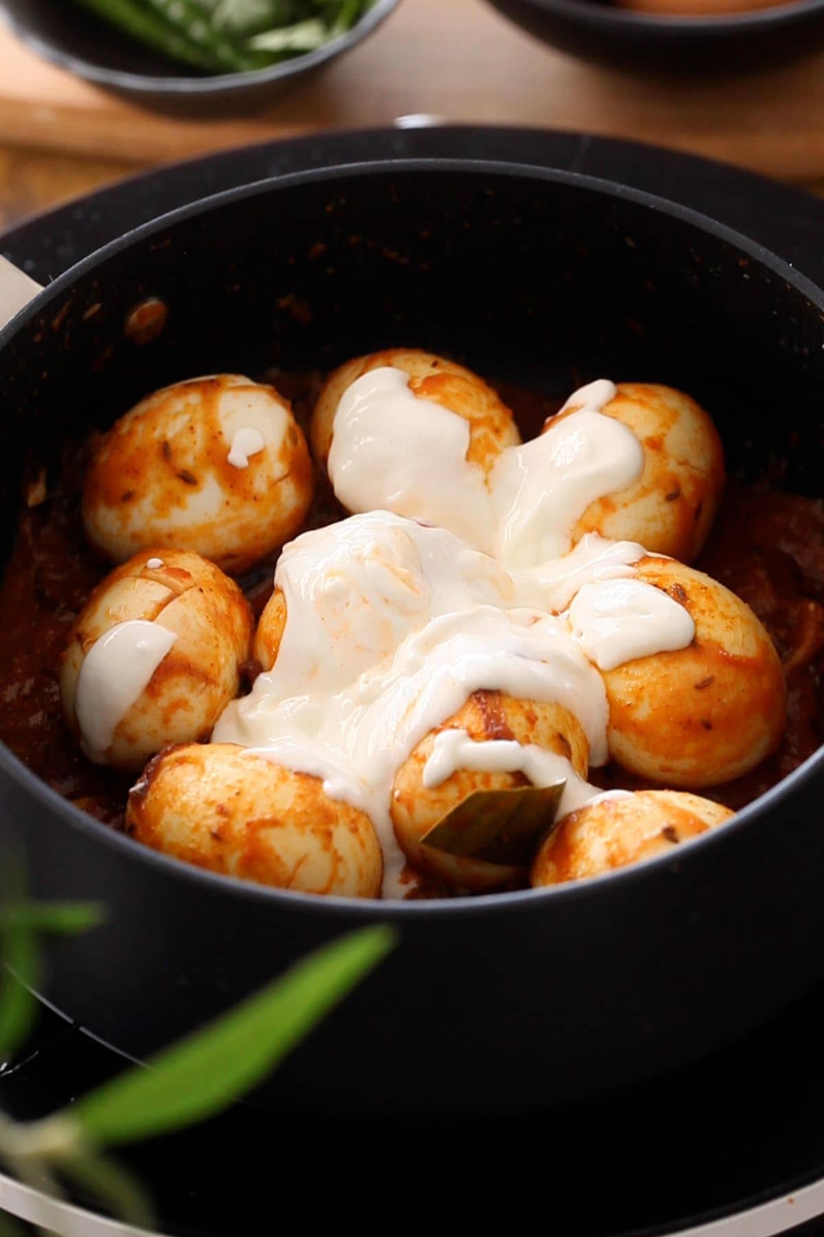 Whisked yogurt is added to egg gravy.