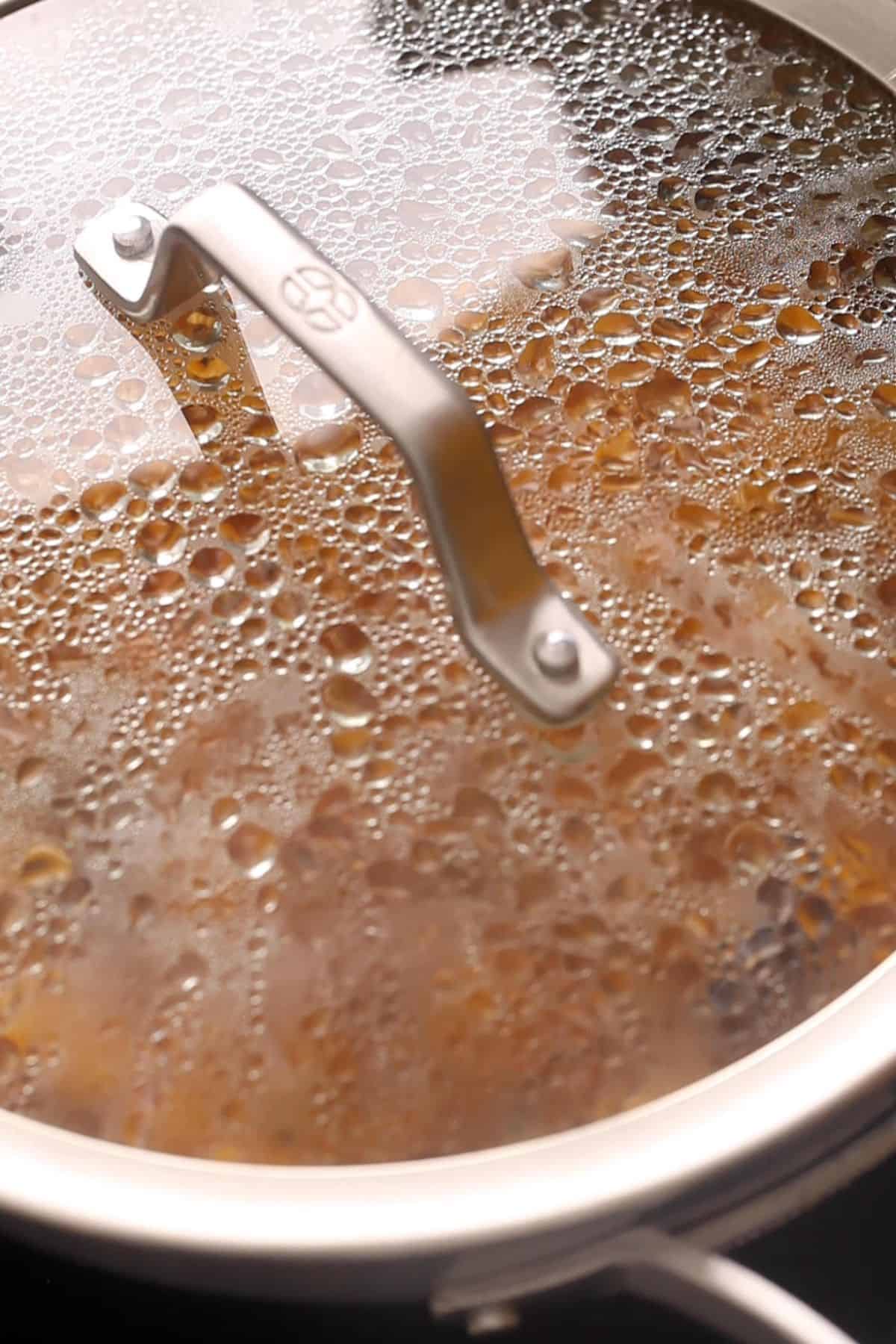 Mango chutney covered and simmering.