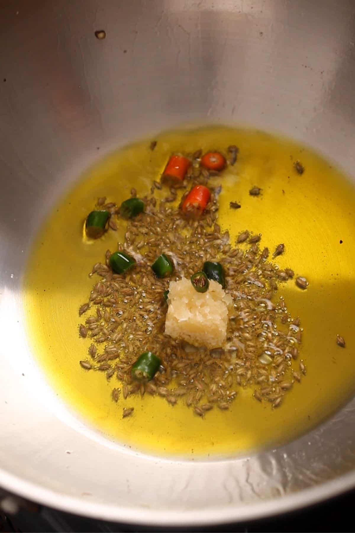 Mustard Oil tempered with spices and green chilli.