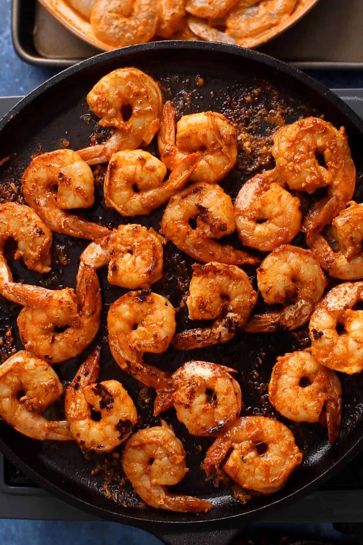 Charred tandoori prawns are cooked and ready. 