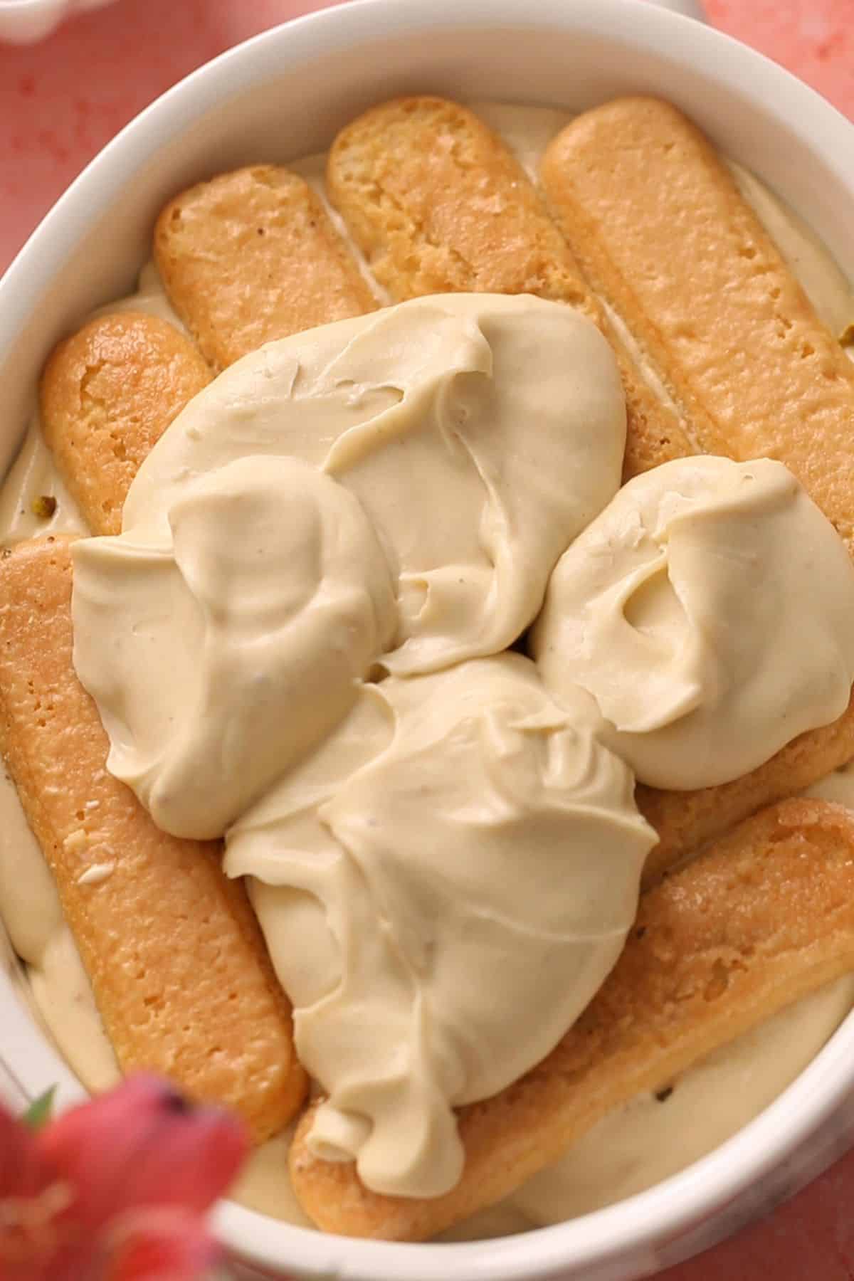 Second layer of soaked ladyfinges and cream added while making tiramisu. 