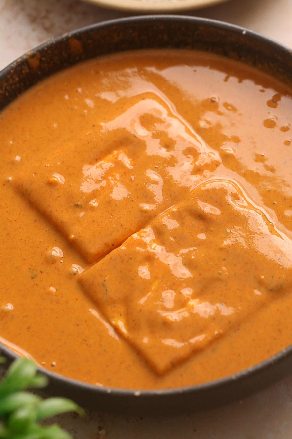 Paneer pieces are dipped into the pakora batter.