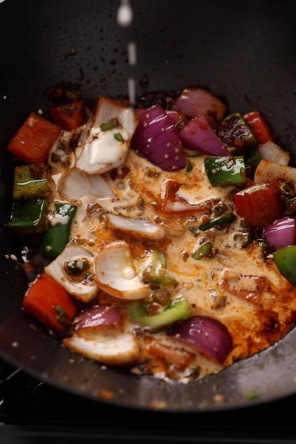 Cornstrach slurry is added to the wok.