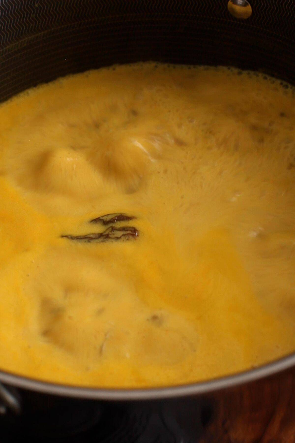 Kadhi mixture comes to the first boil.