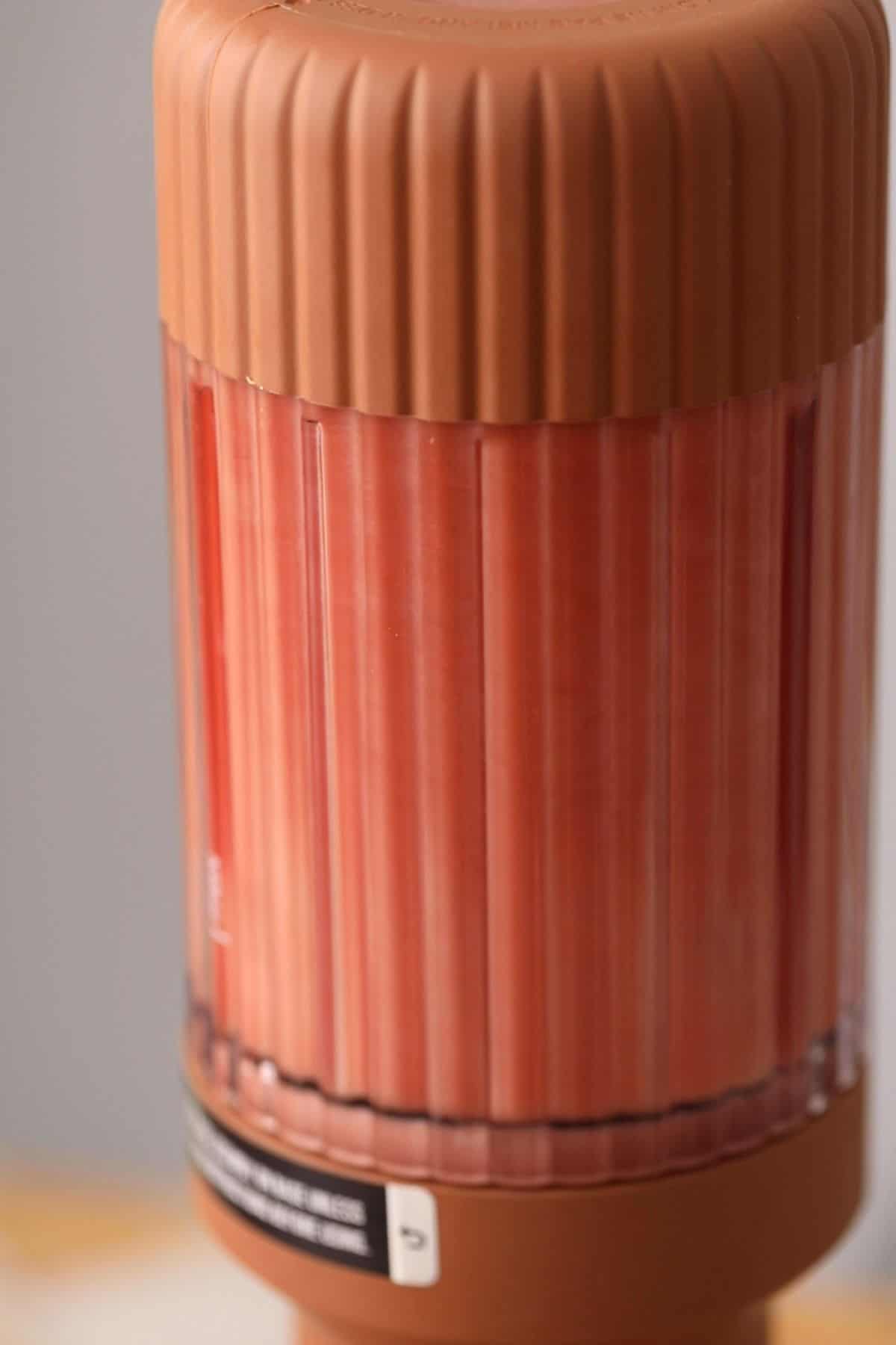 Blending spicy watermelon drink.