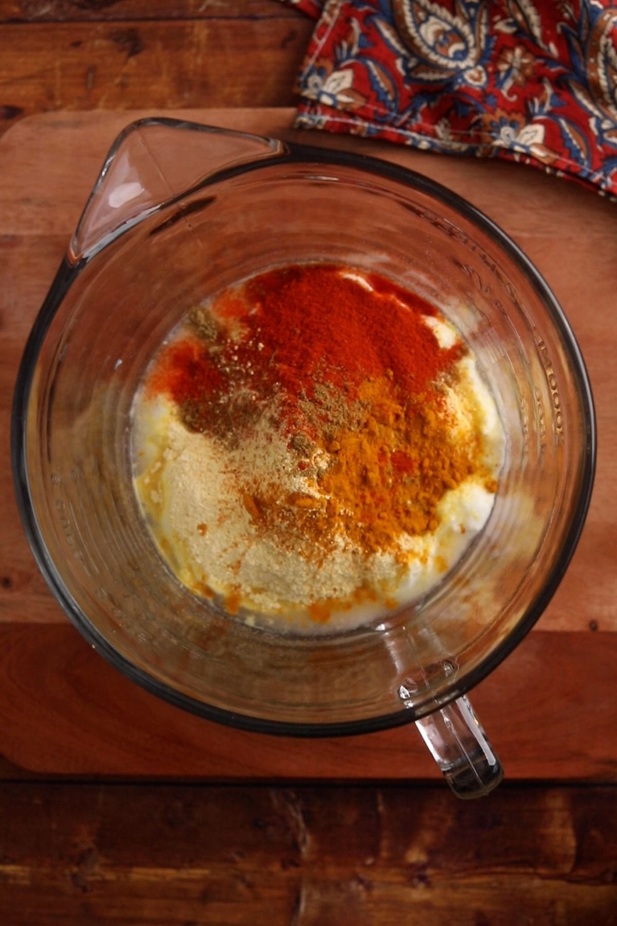 Ground spices are added over the besan.