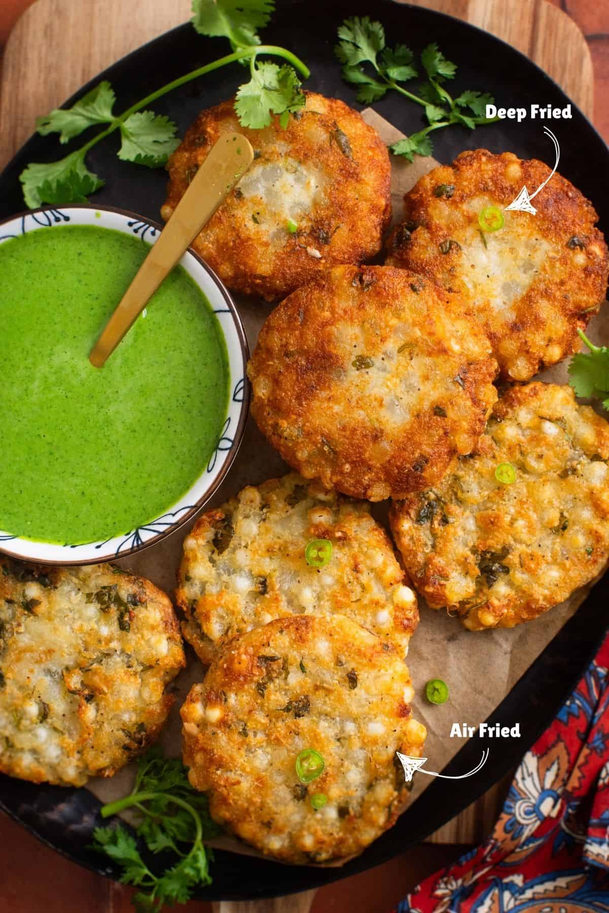 Close up of sabudana vada in a black platter.