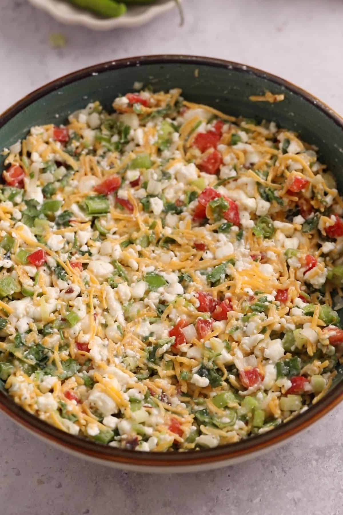 Chilli Cheese toast mixture in a blue bowl.