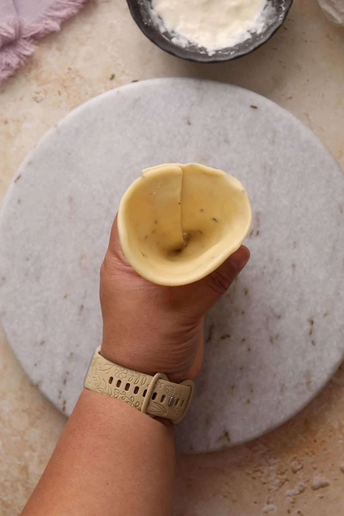 A hollow cone shaoed pocket of samosa crust. 