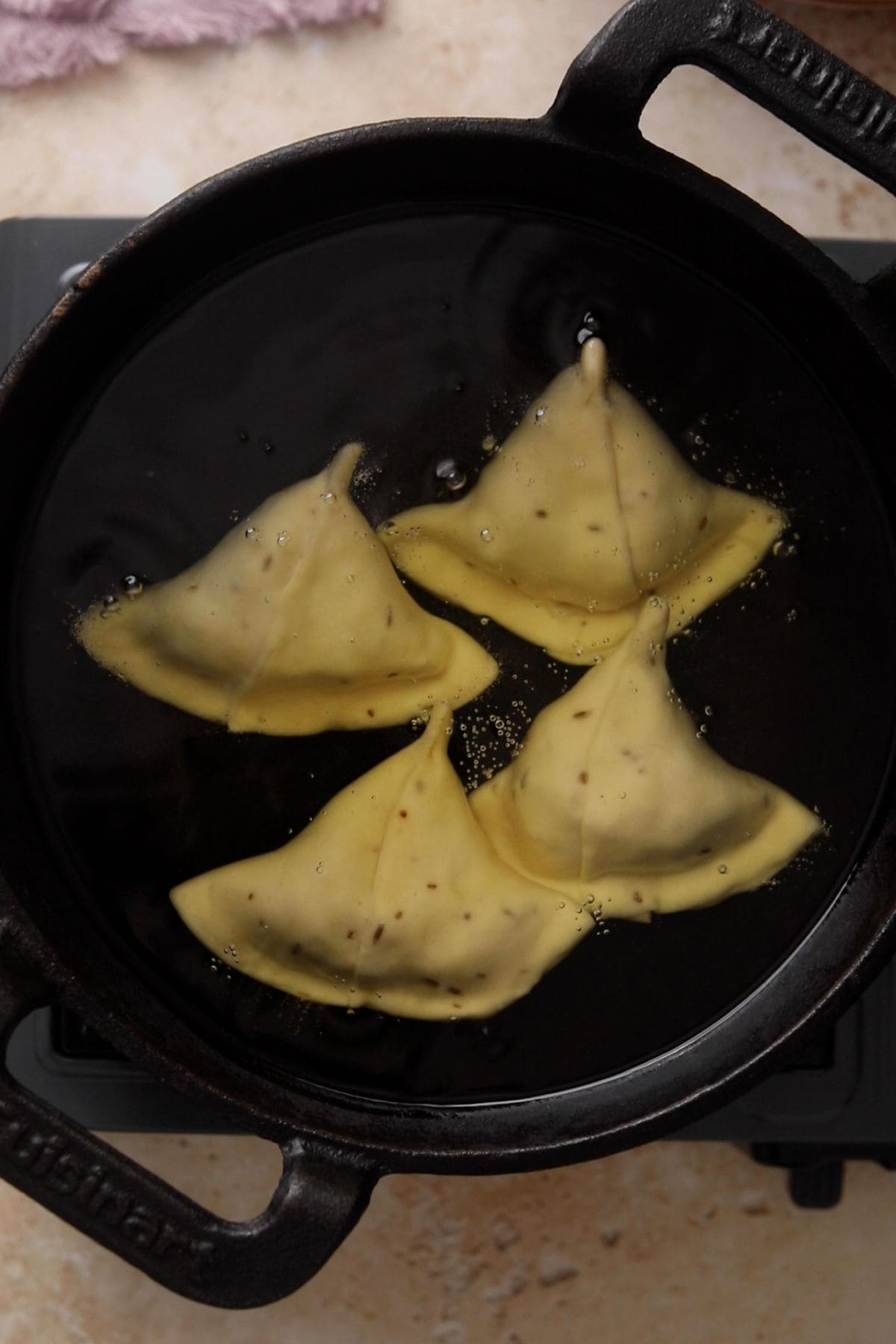 Shaped samosa are added to a oil on  very low heat. 
