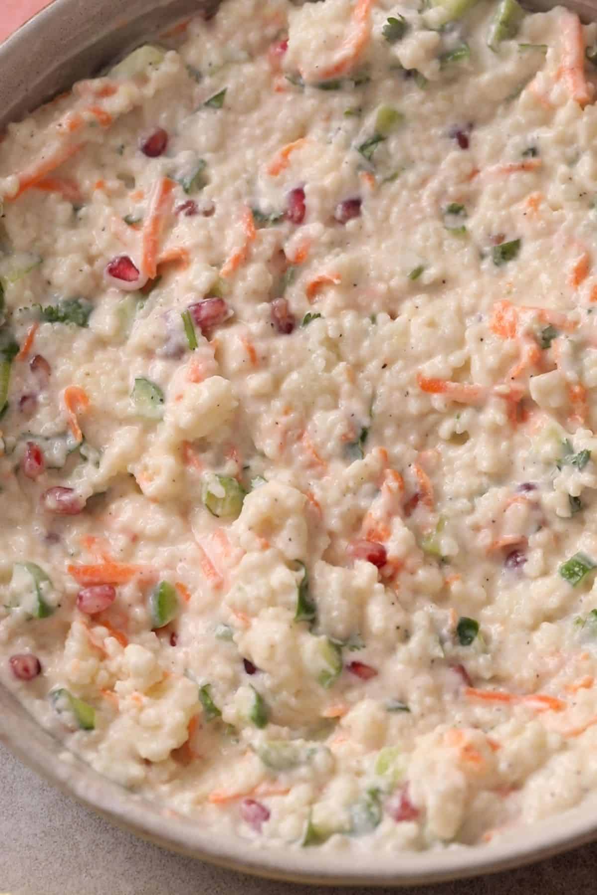 Mixed up samo rice in a white stone bowl.