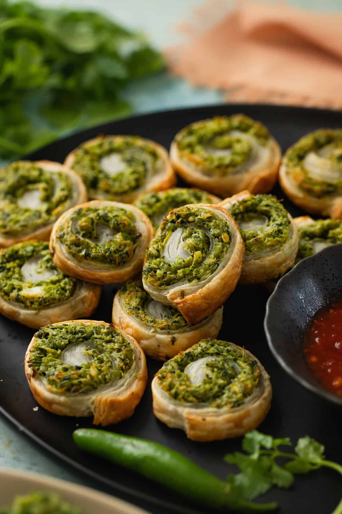 Side close up view of puff pastry hara bhara pinwheels.