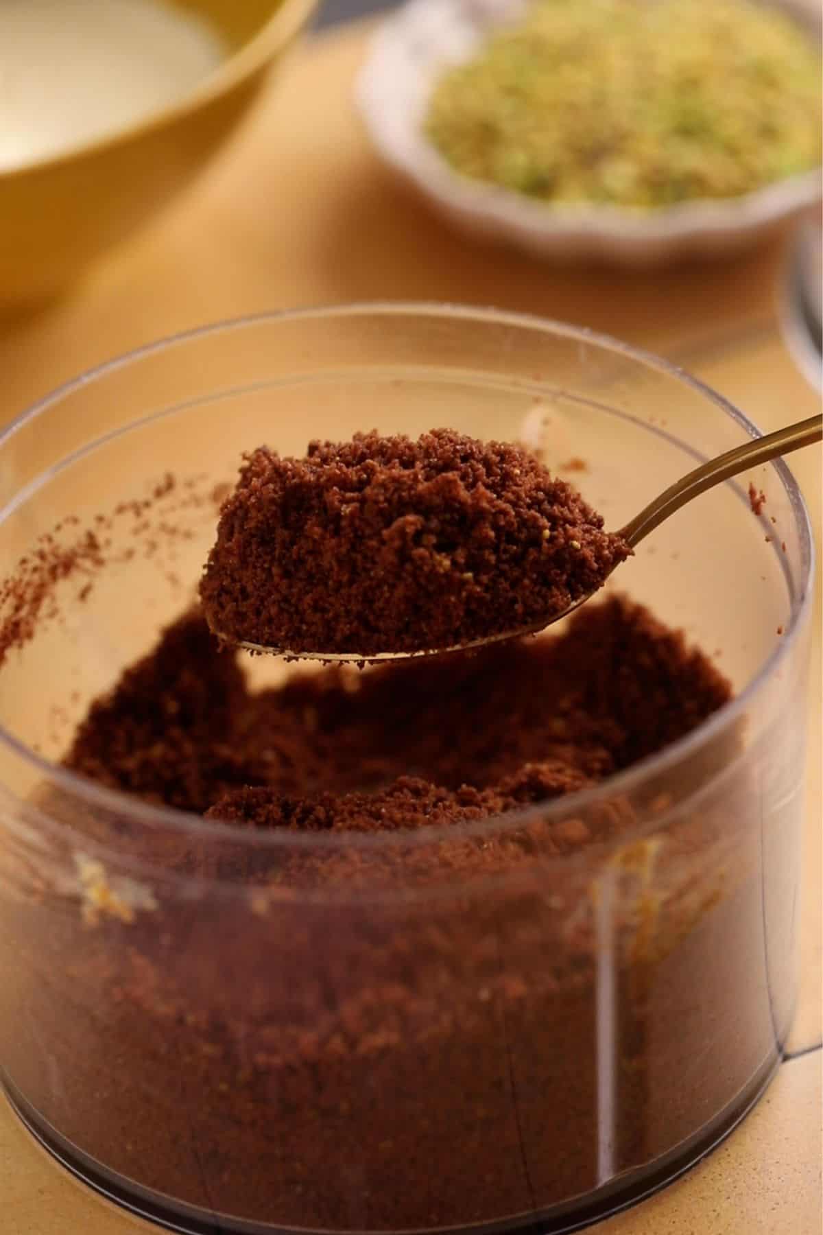 Cookie crumbs in a small spoon.