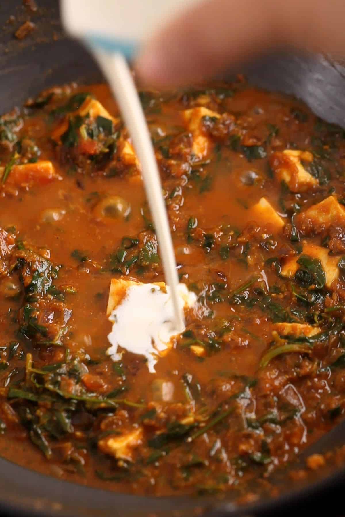 Fresh cream is added to the methi paneer.